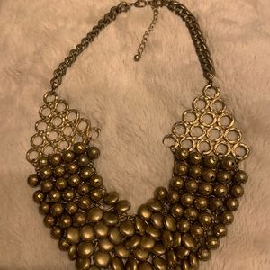 Heavy gold statement piece.